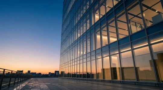 Professional investor analyzing commercial real estate investment data in modern office setting