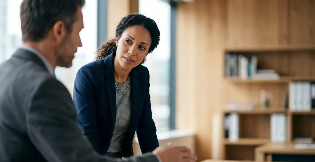 Two business professionals in natural conversation discussing commercial lease terms and references