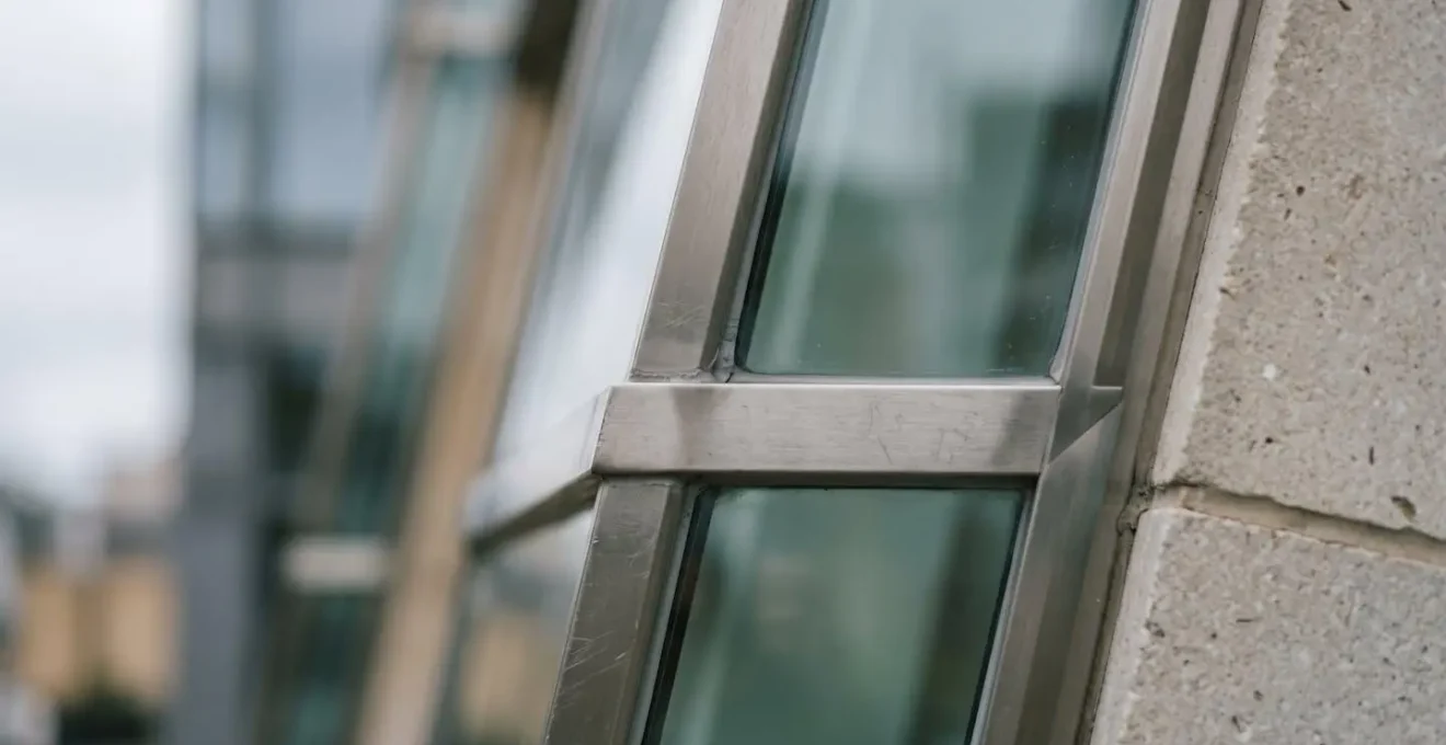 Close-up of modern UK office building facade showing architectural detail and maintenance quality assessment