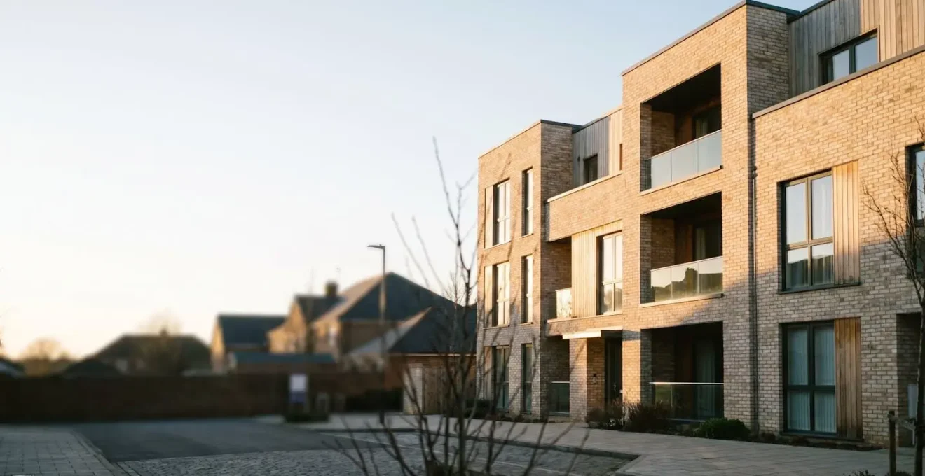 Professional photograph depicting a modern residential property with multiple dwelling units showcasing licensing compliance in an urban environment